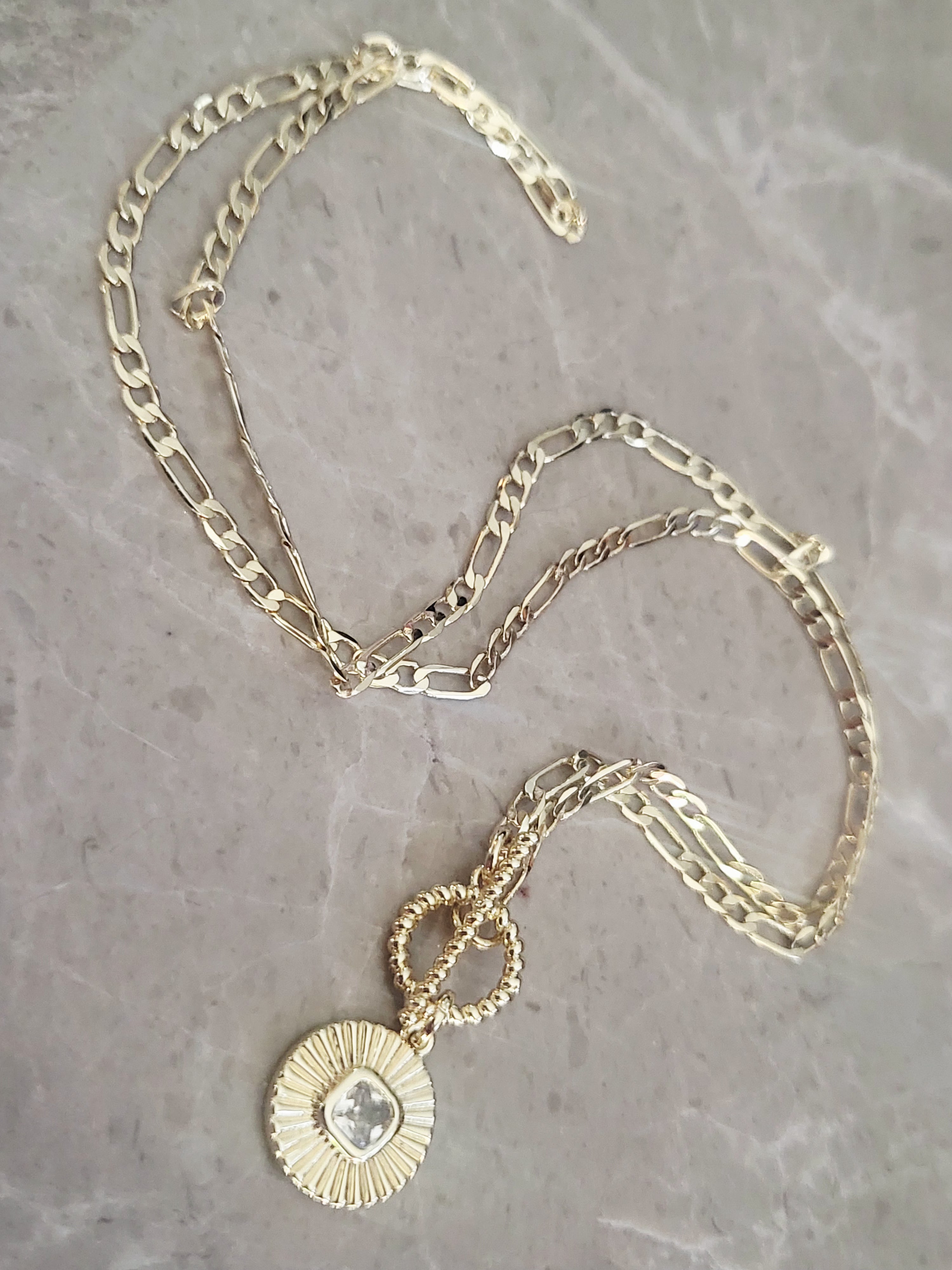 14kt yellow gold plated Crystal round circular pendant necklace.