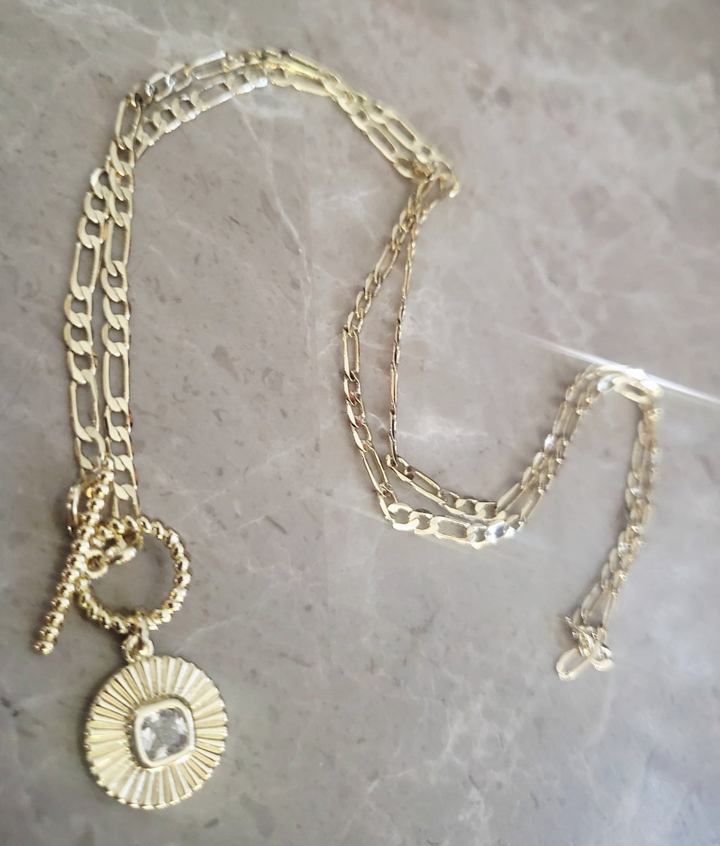 14kt yellow gold plated Crystal round circular pendant necklace.