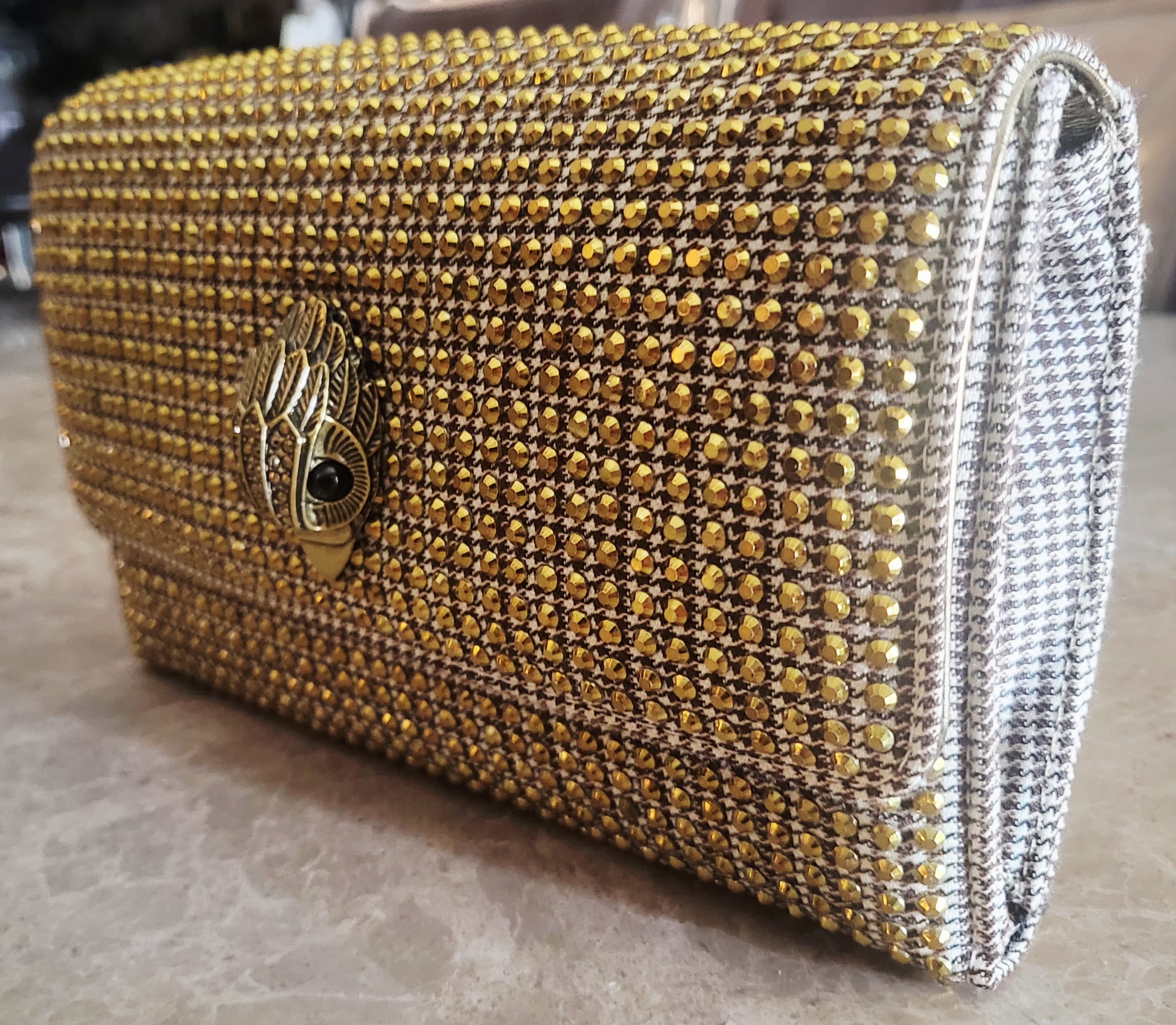 Kurt Geiger London Kensington Gold Studded Houndstooth Eagle Clutch.