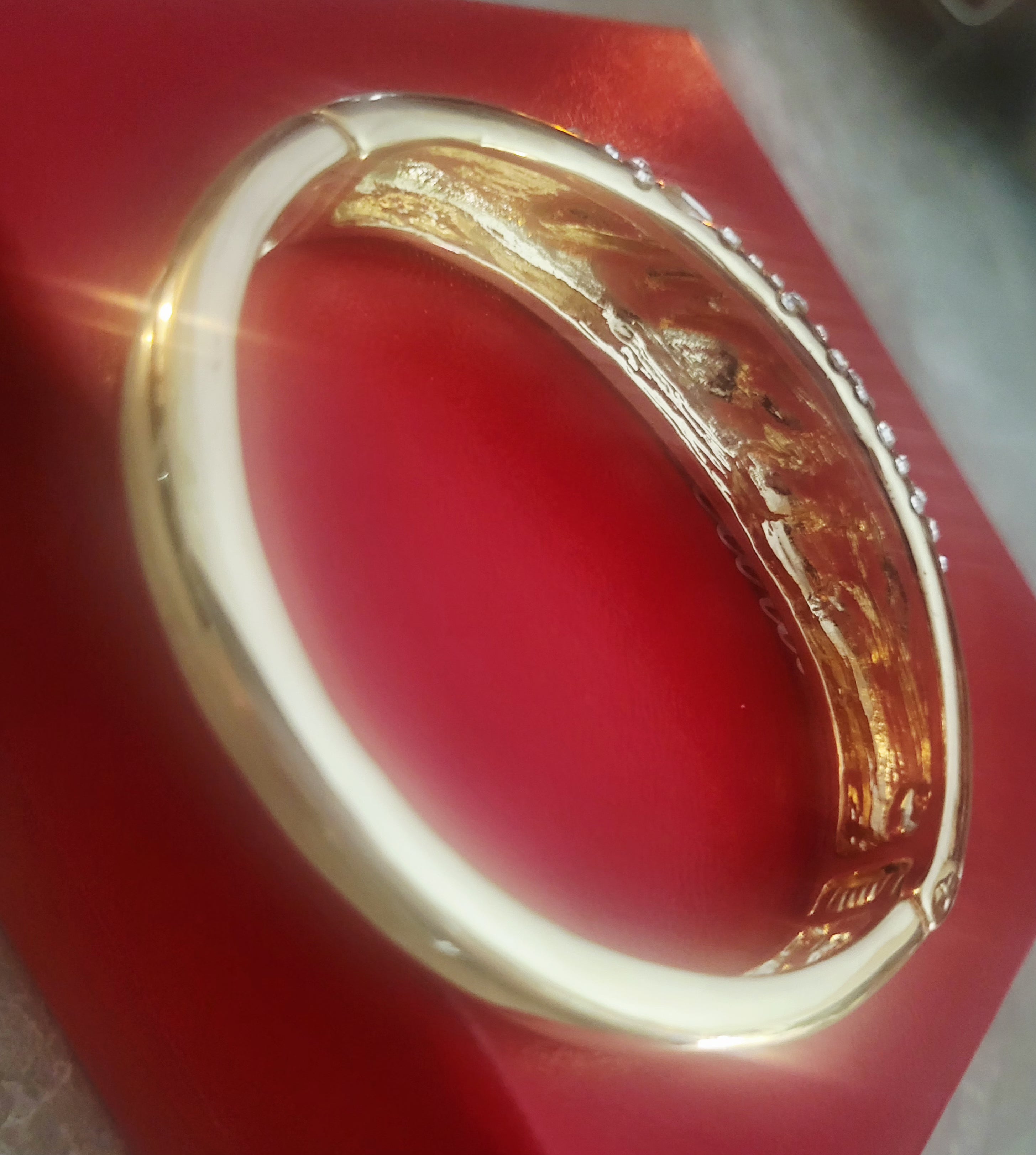 14kt Yellow Gold Plated Bangle w/ Crystal embellishments.