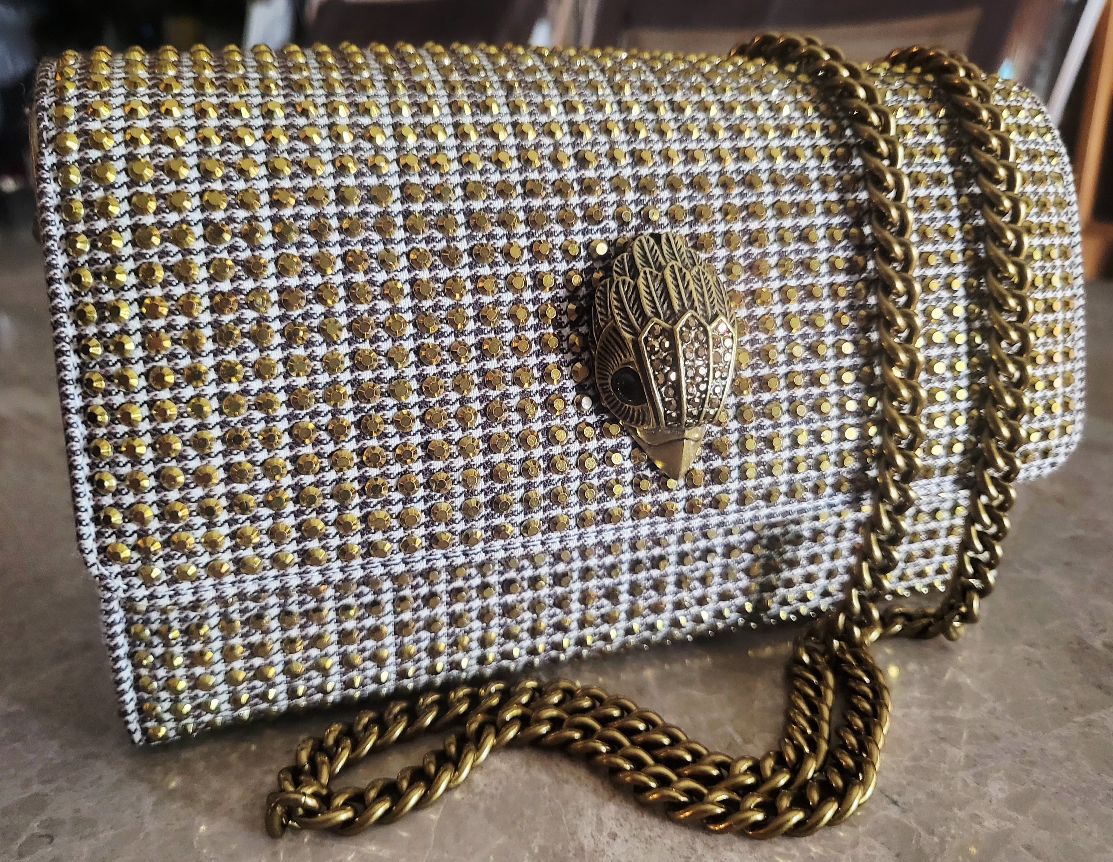 Kurt Geiger London Kensington Gold Studded Houndstooth Eagle Clutch.